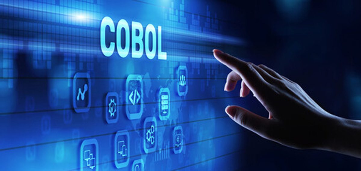 A woman’s hand in front of a COBOL touch screen.